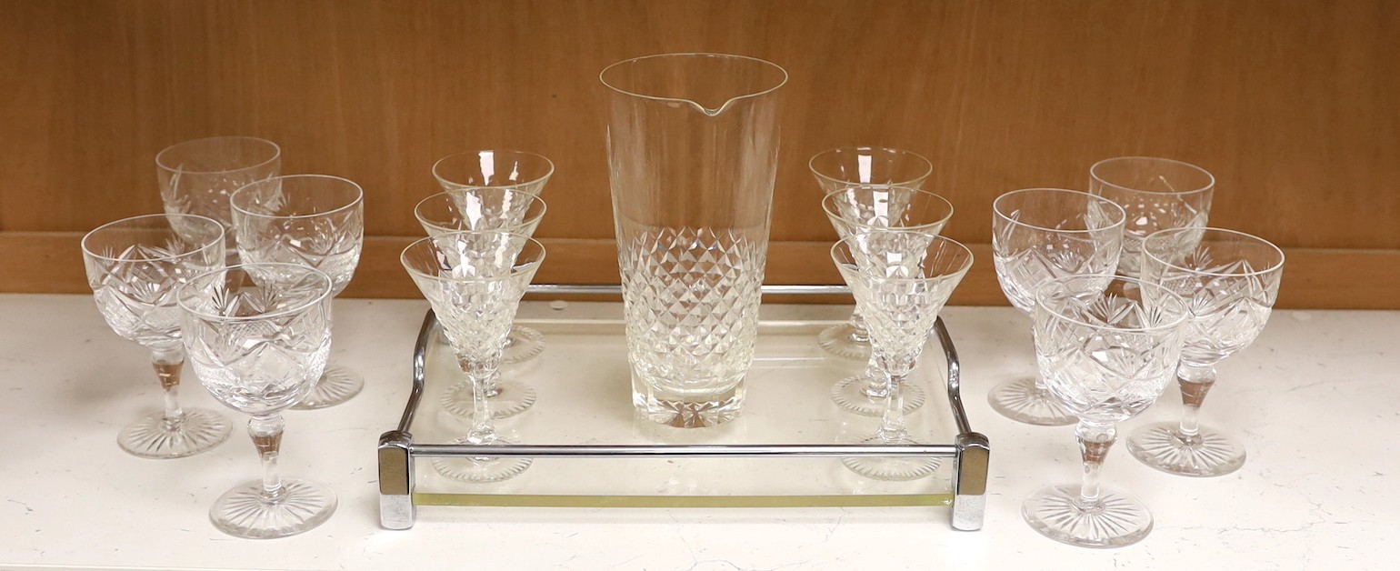 A mid century chrome and perspex drinks tray with 6 cocktail glasses, mixing glass and 8 wine glasses